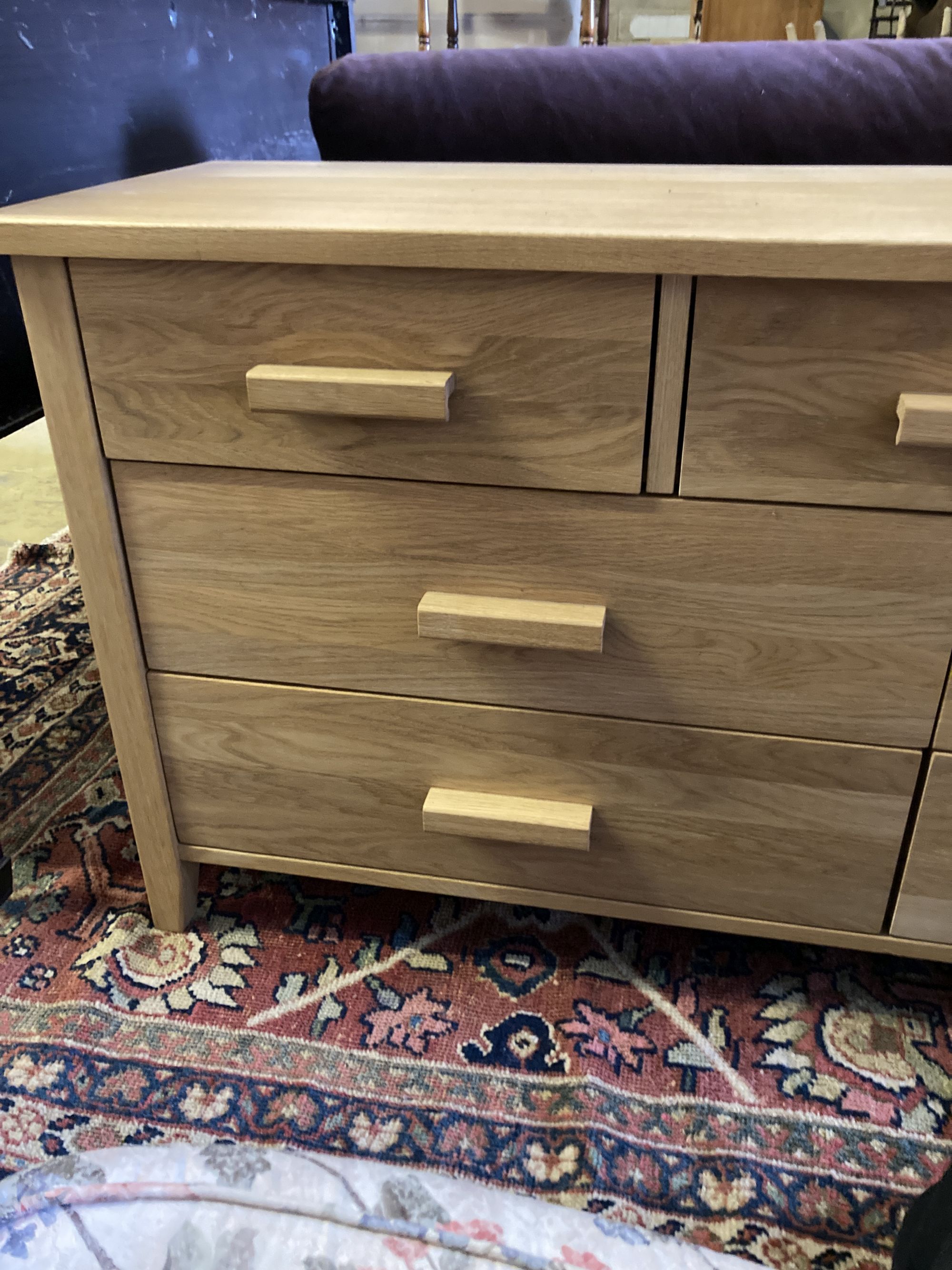 A modern contemporary oak seven-drawer chest, width 150cm, depth 45cm, height 71cm